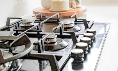 black and white chess pieces on black and silver gas stove