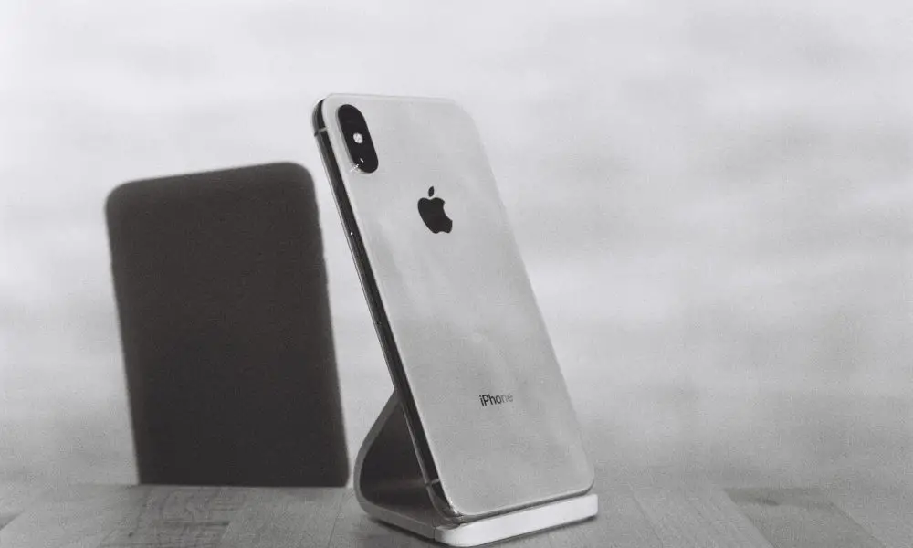 silver iPhone X on stand