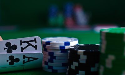 white and black dice on green table