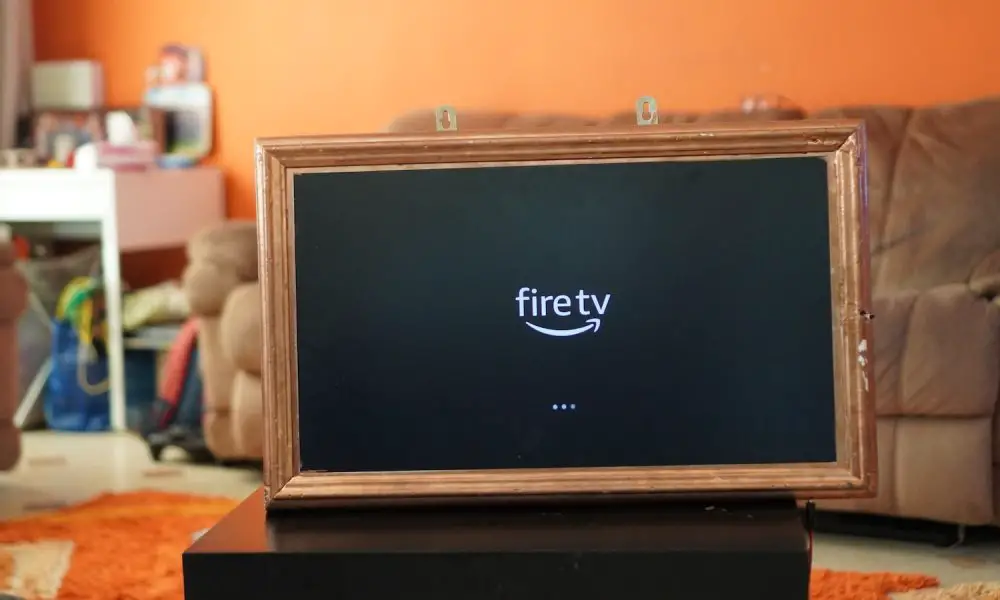 a fire tv sitting on top of a wooden table