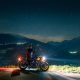 man siting on motorcycle at night