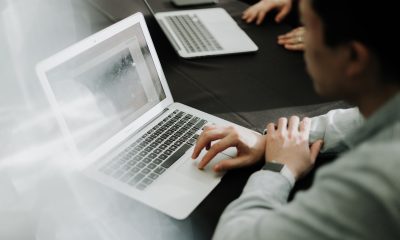 a man sitting in front of a laptop computer