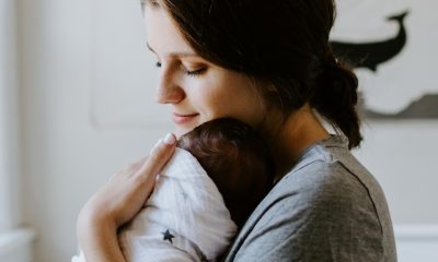 mother carrying baby