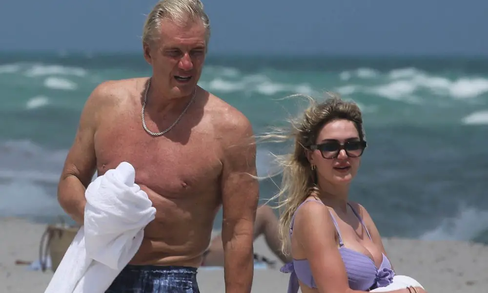 Dolph Lundgren Emma Krokdal beach 040625 ba08b65e42cb49c38c7403a47d7664f5