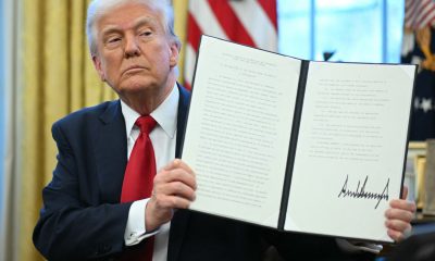 INV TrumpwithAutoTariffEO GettyImages 2206481891 8626d9b55e3f4097bcbd6ea6e55a9730