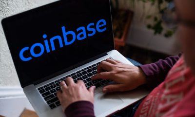 coinbase logo on laptop bloomberg scaled