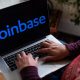coinbase logo on laptop bloomberg scaled