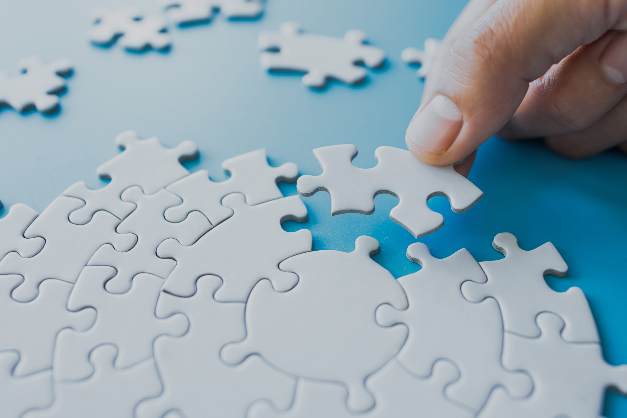 white jigsaw puzzle pieces 464575513 bigstock scaled