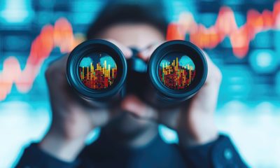 investor with binoculars for strategic opportunity 1067159406 AdobeStock scaled