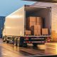 boxes loaded on large truck outside warehouse 622375139 AdobeStock scaled