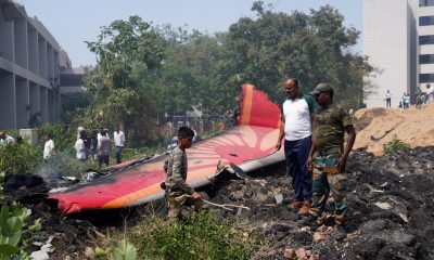 debris at crash site of air india flight bloomberg scaled