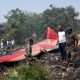debris at crash site of air india flight bloomberg scaled