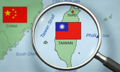taiwan on map with magnifying glass 521872267 AdobeStock scaled