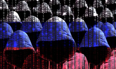hooded hackers with digital russian flag 151236836 AdobeStock scaled