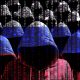 hooded hackers with digital russian flag 151236836 AdobeStock scaled