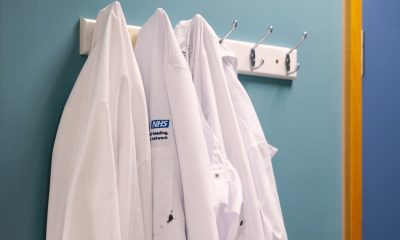nhs logo on laboratory coats bloomberg scaled