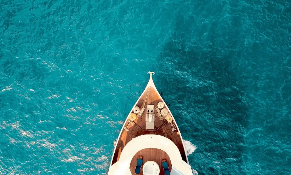 birds eye photography of boat on body of water